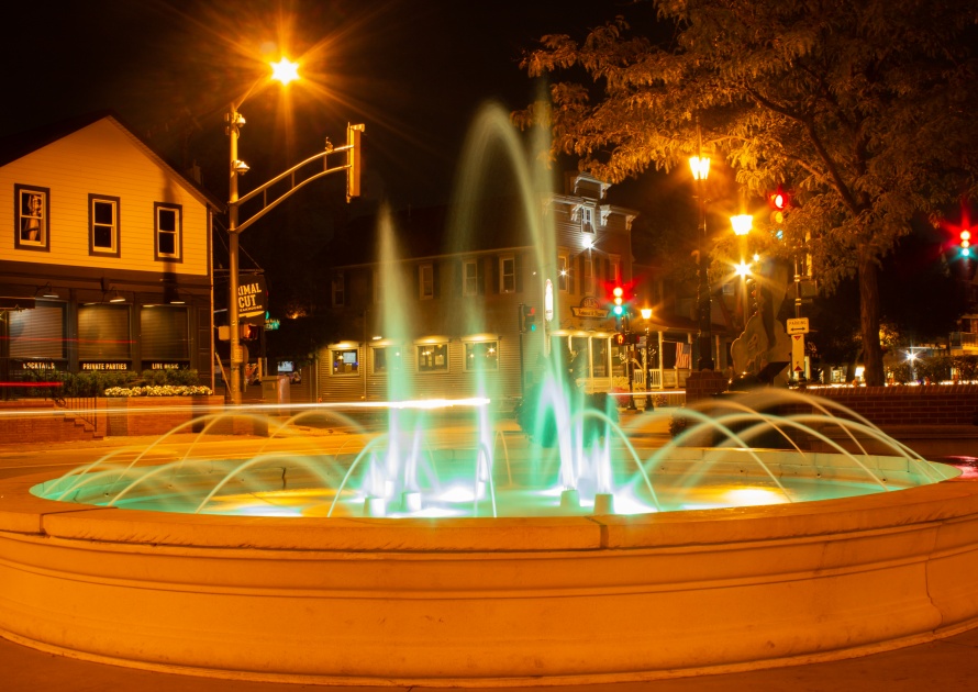 Tinley Park, Illinois / United States of America - October 10th 2019: A long-exposure of the lighted fountain in downtown Tinley Park.