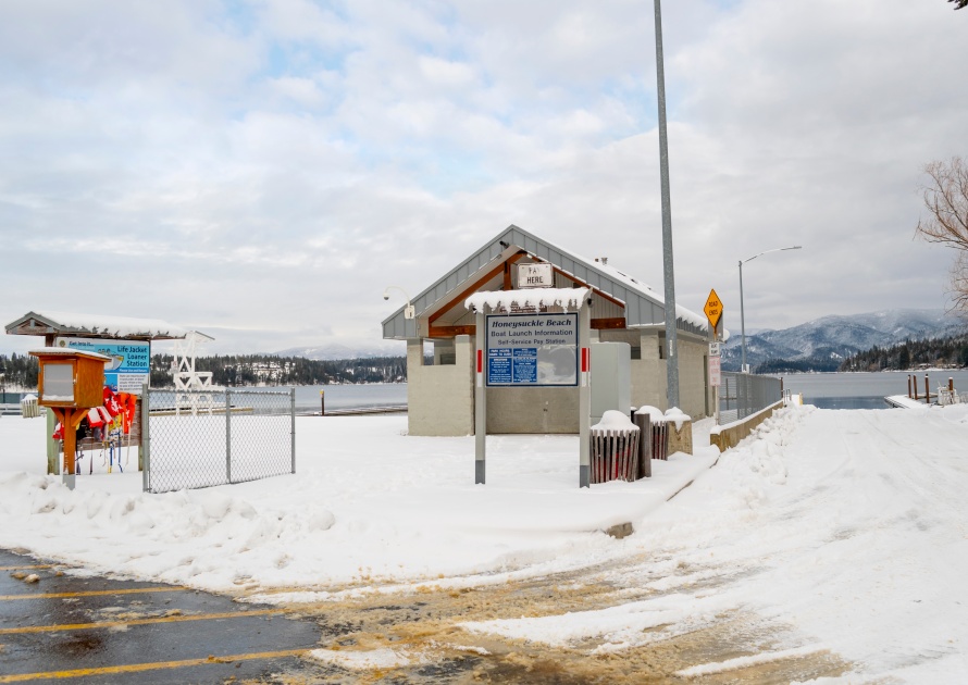 Hayden Lake, Idaho USA - January 14 2019: The public change house, life jacket station and boat launch at Honeysuckle Beach, Hayden Lake, Idaho USA, site of many winter slide-offs in the lake.