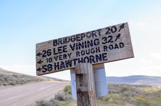 Bodie Ghost Town road sign, giving drivers directions to the local towns of Lee Vining, Hawthorne and Bridgep.