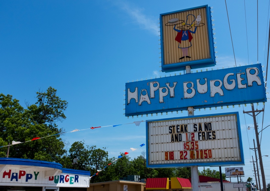 Sapulpa, Oklahoma, USA - July 8, 2014: The sign for the Happy Burger restaurant, in the city of Sapulpa, along the route 66 in the State of Oklahoma, USA.