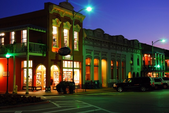 Oxford, MS, USA July 21 Square Books, a famed independent book store, glows against the dusk sky in Oxford, Mississippi