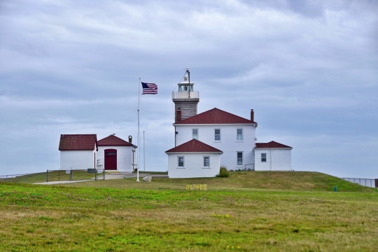 Westerly, Rhode Island/USA- July 25, 2018: A horizontal image of the iconic Watch Hill Light in seaside Watch Hill.