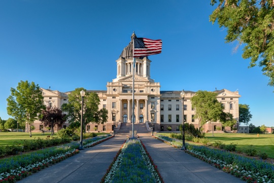 Exterior of the South Dakota State Capitol building on a clear, summer day