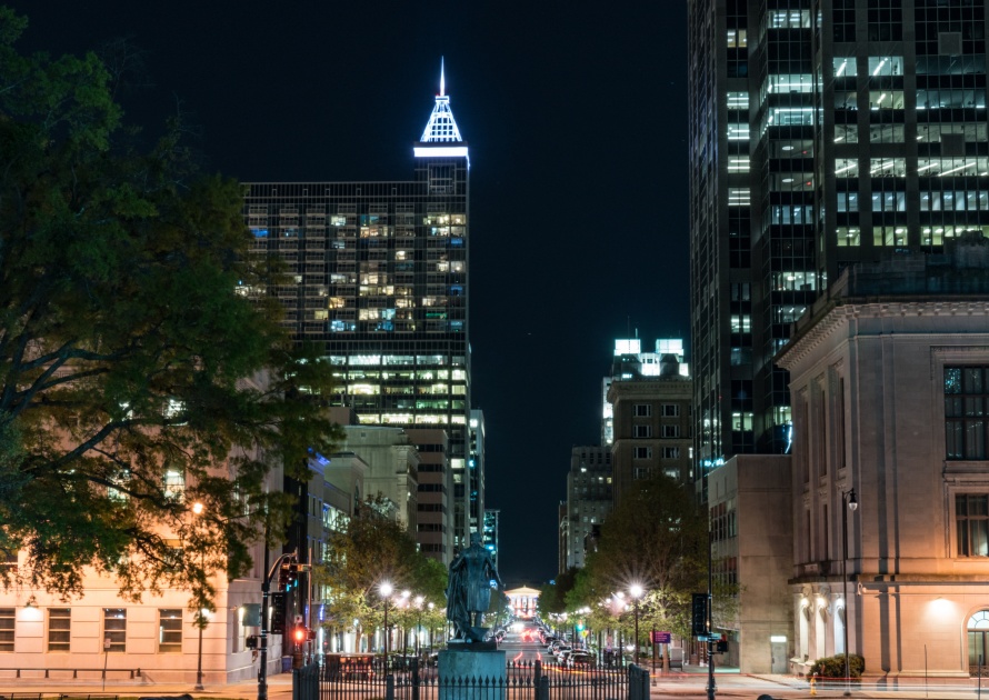 RALEIGH, NC - APRIL 17, 2018: George Washington Statue and Downtown Raleigh, North Carolina on Fayetteville Street from the Capitol Building at night