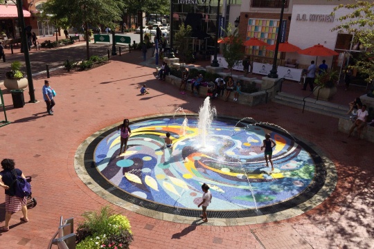 MARYLAND, USA - AUGUST 12: Children play around fountain area on August 12, 2015 in Downtown Silver Spring, Maryland, USA.