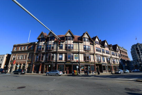 QUINCY, MA, USA - OCT. 20, 2013: Adams Building, built in 1880, is a historical commercial building with Tudor Revival style at Hancock Street in downtown Quincy, Massachusetts, USA.