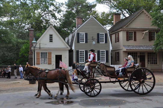 Horse drawn carriage rides in Williamsburg, Virginia. Car, walks.
