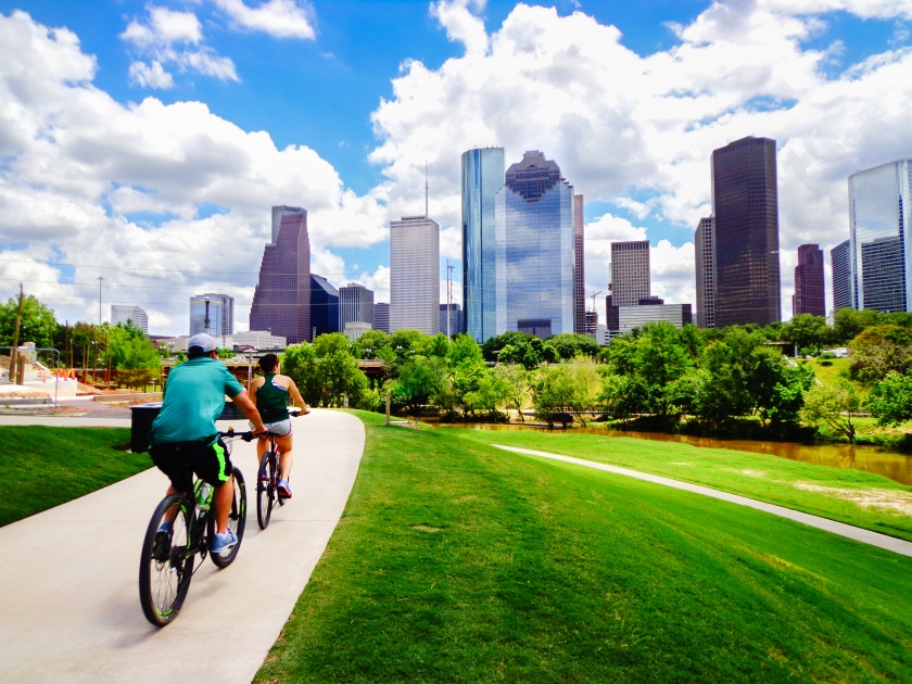 Bicycles on Camino Paved in Houston Park (view of the river and downtown Houston skyline) - Houston, Texas, USA