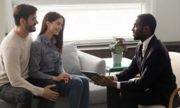 Couple meeting with a real estate investor