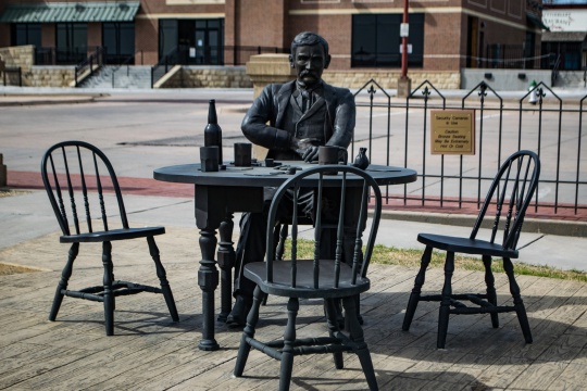 Bronze sculpture of Doc Holliday, the legendary lawyer and poker player, in Dodge City Kansas