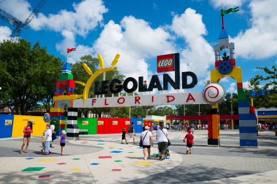 WINTER HAVEN, FL - June 18, 2014: Visitors pass through the entrance to Legoland Florida in Winter Haven, FL, on June 18, 2014.