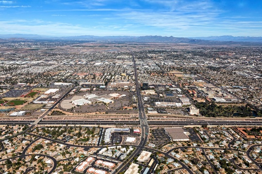 Aerial view of Main Street in downtown Mesa, Arizona with light rail transportation near completion