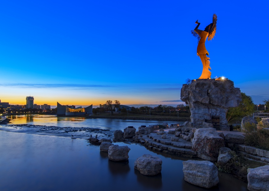 Plain Indian Keeper in Wichita, Kansas at dawn. Steel sculpture of Blackbear Bosin that stands on the shore of the Arkansas River.