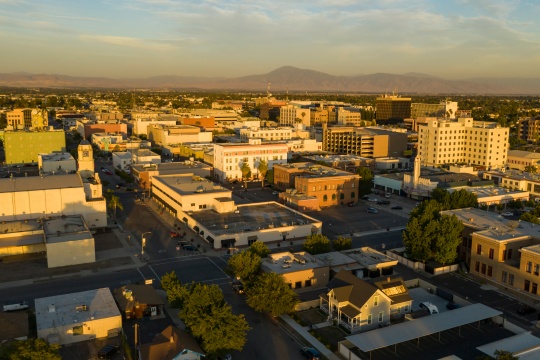 Aerial view of downtown Bakersfield, south of the city, illuminated by afternoon light