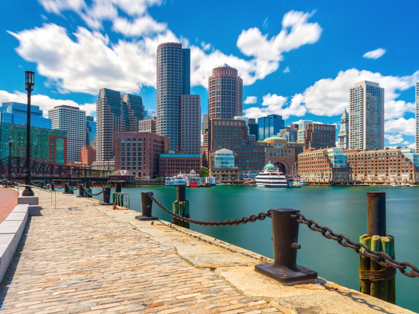 Boston skyline on sunny summer day, viewed from the harbor in central Massachusetts, USA