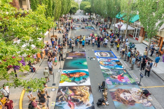 REDMOND, WA / USA - AUGUST 19, 2018: Spectators enjoy art at Chalkfest event in Redmond, Washington Location is Redmond Town Center
