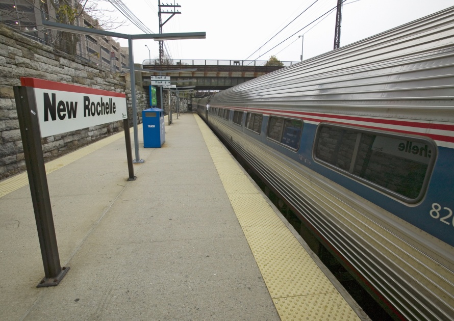Amtrak train departs New Rochelle train station, New York, New York