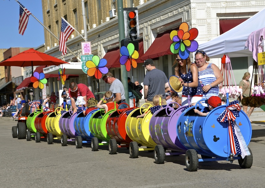 MANDAN, NORTH DAKOTA, July 3, 2016: A Walt Disney decorated kiddie train provides rides at the 4th annual days of July Rodeo, parade, art show, and festivities in downtown Mandan, ND